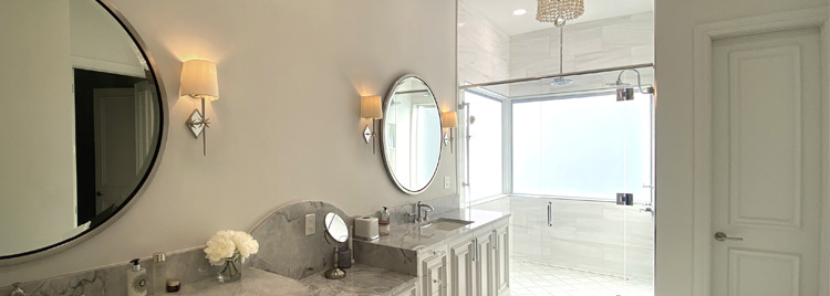 Dual vanity modern bathroom with circular mirrors