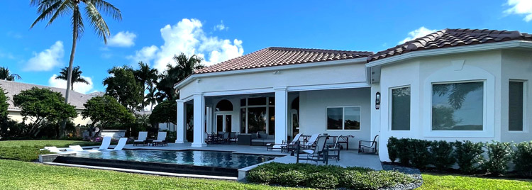 Backyard of contemporary home with swimming pool.