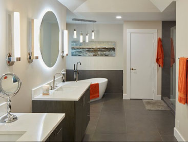 Dual vanity bathroom with wood floor and free standing bathtub